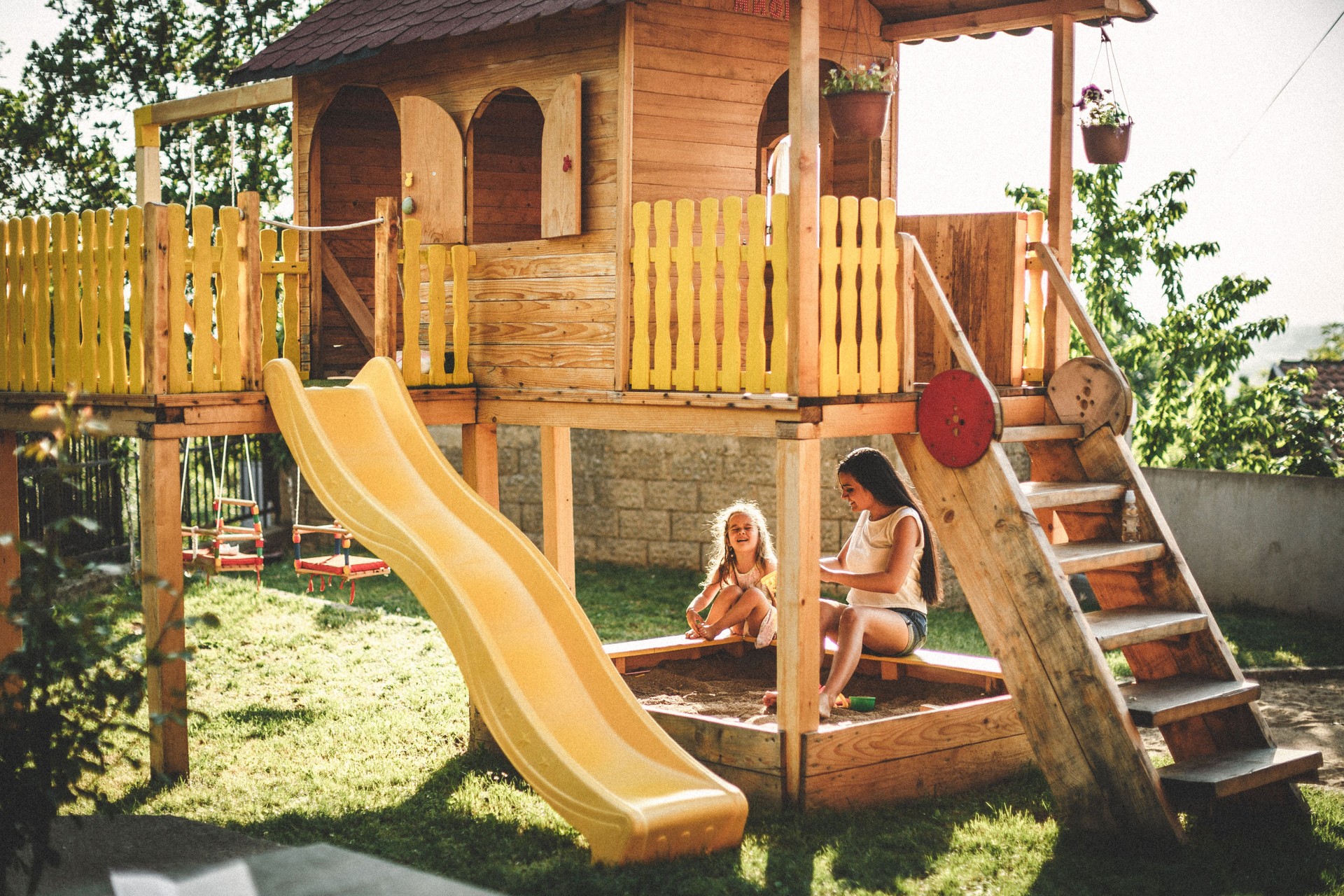 Mother and daughter having fun in playground